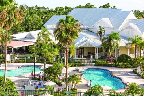 an aerial view of a resort with a pool and palm trees at WorldMark Orlando Kingstown Reef in Orlando