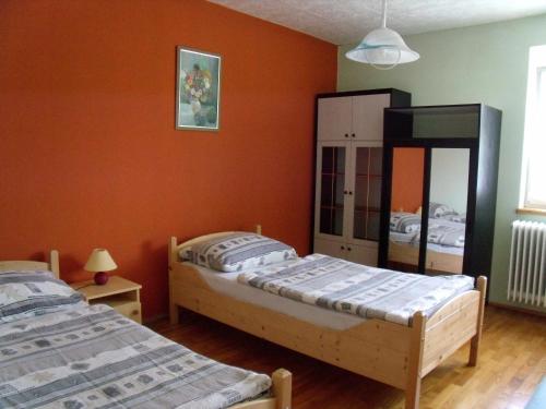 A bed or beds in a room at Viola Vendégház