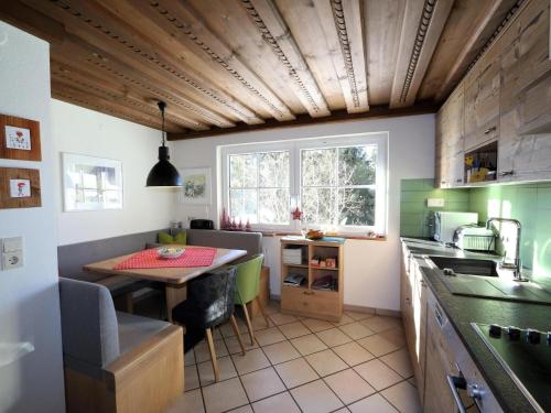 a kitchen with a table and a small dining room at Chalet in Flachau near Ski Slopes in Flachau