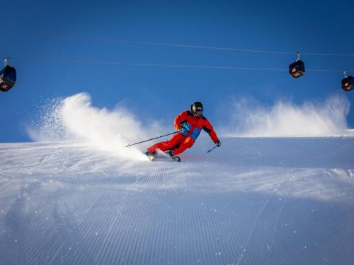 a person is skiing down a snow covered slope at Apartment building, Fügen in Fügen