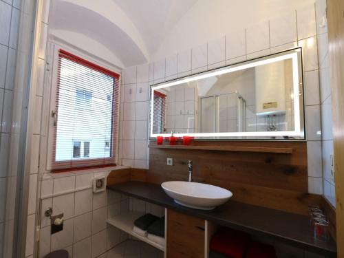 a bathroom with a sink and a mirror at Apartment building, Fügen in Fügen