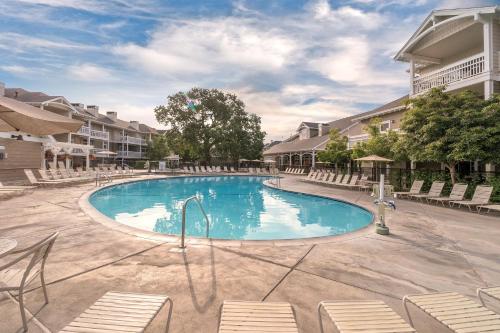 a swimming pool at a resort with chairs at WorldMark Windsor in Windsor