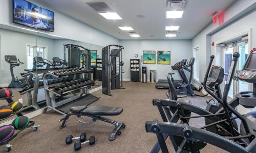 a gym with several treadmills and cardio machines at Margaritaville Vacation Club - St Thomas in Frydendal