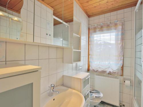 a bathroom with a sink and a toilet at Apartment in Niedernsill near Ski Slopes in Niedernsill