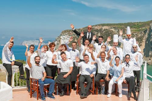 a group of people posing for a picture on a deck at Hotel Chiaia Di Luna in Ponza