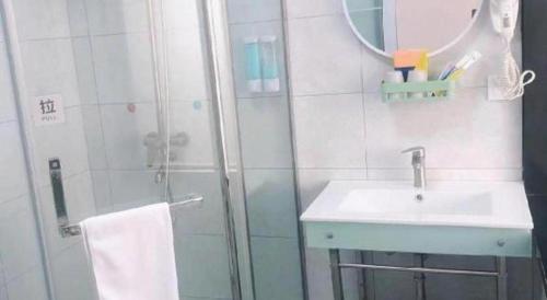 a bathroom with a shower and a sink at 7 Days Inn·Taixing Wenchang Road in Taixing