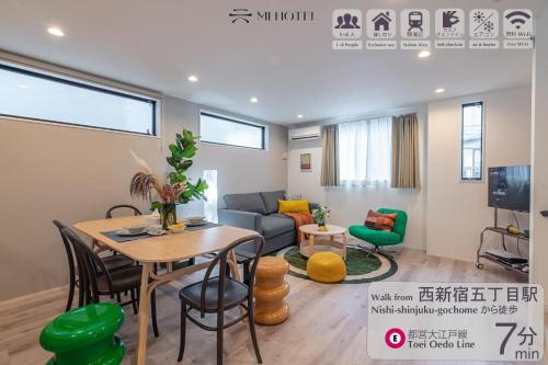 a living room with a table and a couch at Mi-Villa SHIBUYA HONMACHI in Tokyo