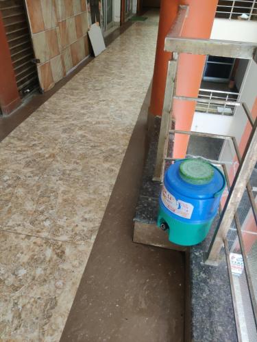a blue bucket sitting on the side of a building at Hotel Mahadev in Kullu Manali