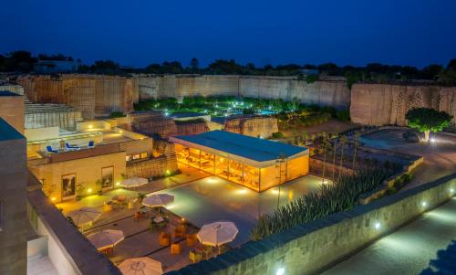 an aerial view of a building at night at Cave Bianche Hotel in Favignana