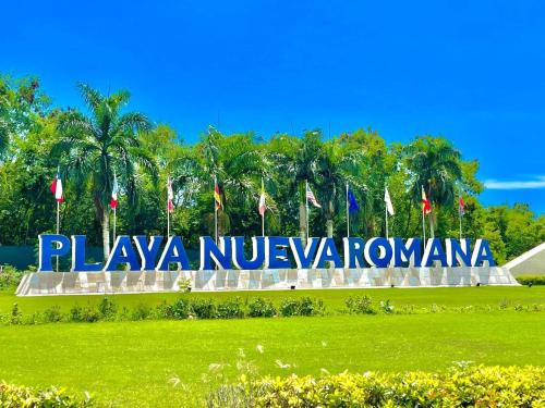 a large sign that reads playa nucayaulum at Residencial la ensenada, on Playa Nueva Romana in Boca del Soco