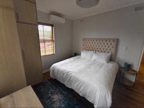 Postel nebo postele na pokoji v ubytování Ouwerf Guesthouse