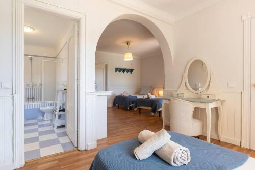 a room with a bed and a living room at Villa Los Tres Almendros in Marbella