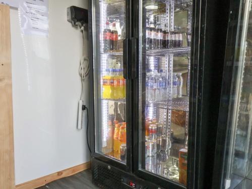 a refrigerator filled with lots of drinks at Mini pod in Scarborough