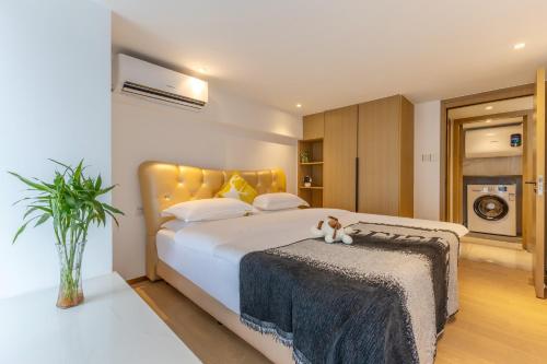 Postel nebo postele na pokoji v ubytování Duoya International Apartment