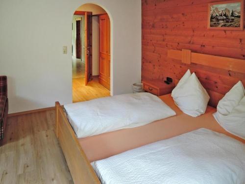 a bedroom with two beds and a hallway at Apartment in Fusch an der Glocknerstraße in nature in Fusch an der Glocknerstraße