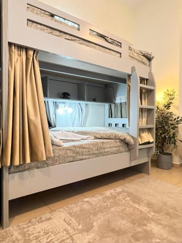 a bed in a room with a bed frame at Sadaf 7 House Jbr for tourists - BEDSPACE in Dubai