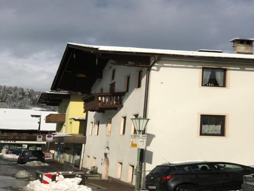 a black car parked in front of a building at Apartment building, Fügen in Fügen