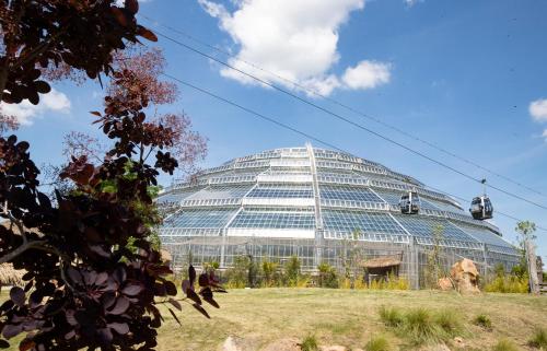 a large glass building with a cable car in front at Grand Hôtel Saint-Aignan in Saint-Aignan