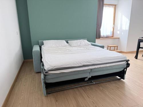 Postel nebo postele na pokoji v ubytování Ampio bilocale Bormio centro