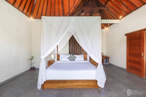 Katil atau katil-katil dalam bilik di Tumbu Retreat
