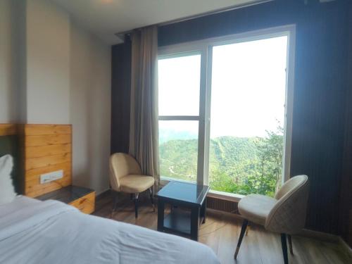 Ένα ή περισσότερα κρεβάτια σε δωμάτιο στο Dolphin Peaceful Location Resort