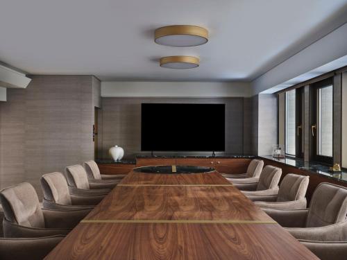 a conference room with a large wooden table and chairs at Anthology of Athens, The Leading Hotels of the World in Athens