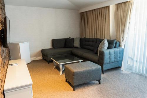 a living room with a couch and a table at Galata Fil Hotel in Istanbul