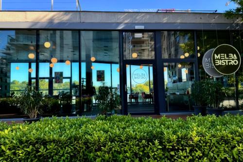 a restaurant with glass doors and a sign on it at Prestige Yacht Resort Budapest in Budapest