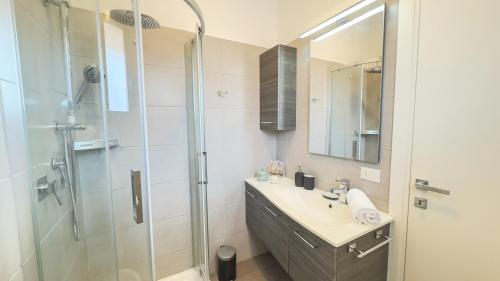 a bathroom with a sink and a shower at Suite Canal Salso by Ca-Sa Check in Mestre