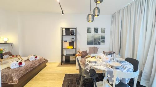 a living room with a table and a bed at Suite Canal Salso by Ca-Sa Check in Mestre