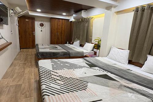 Hotel Anantshreeにあるベッド