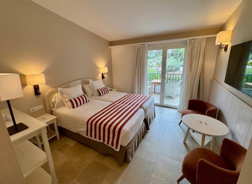 Кровать или кровати в номере Hotel Playa Sol