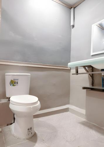 a bathroom with a white toilet in a room at CASA Sukhumvit XI -ซอยสุขุมวิท 11 in Makkasan