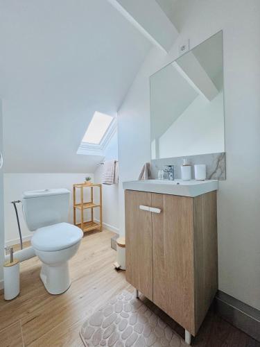 a bathroom with a toilet and a sink at Dreamz in Calais
