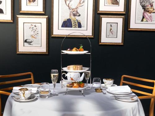 a table with plates of food on top of it at Fairmont St Andrews, Scotland in St. Andrews