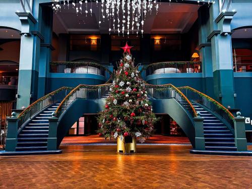 a christmas tree in the middle of a building at Fairmont St Andrews, Scotland in St. Andrews