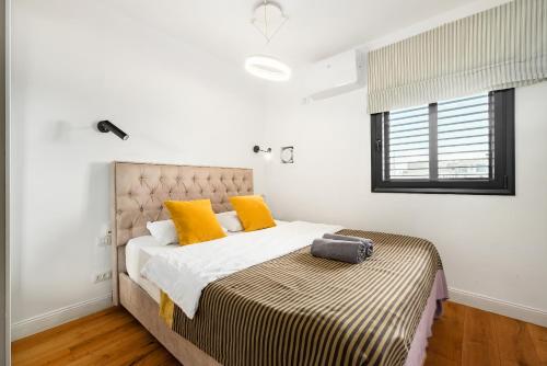 En eller flere senge i et værelse på Blue Horizon