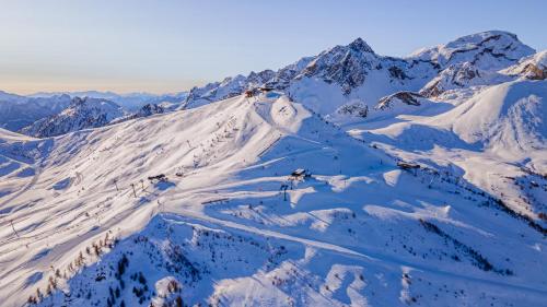 an aerial view of a snow covered mountain at Garrigae Caserne de Briançon & SPA Cinq Mondes in Briançon