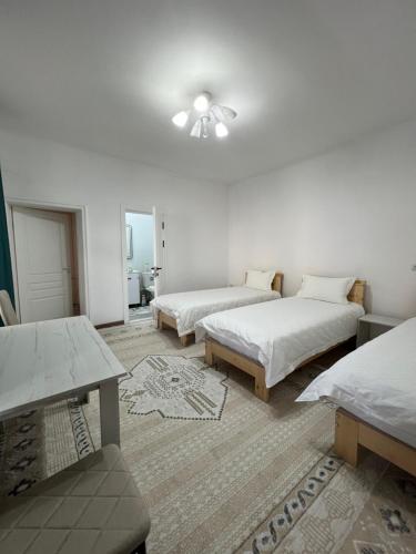Ein Bett oder Betten in einem Zimmer der Unterkunft Табылга guest house