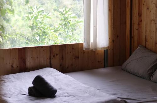 Postel nebo postele na pokoji v ubytování Phong Lu Homestay Dalat