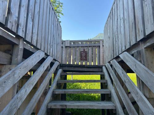 a wooden gate leading up to a wooden fence at Pferdeblick Hütte in Rottenmann