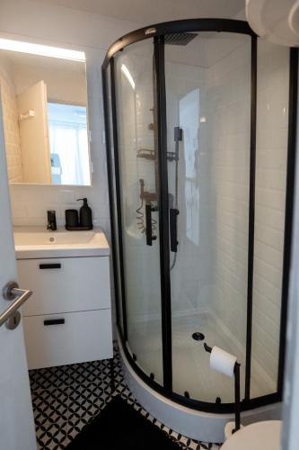 a bathroom with a shower and a sink at White House Balatonberény in Balatonberény
