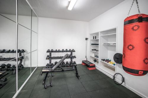 a gym with a punching bag hanging from the ceiling at Hyde Park Lane in Puerto del Carmen
