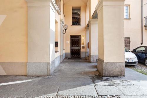 a hallway of a building with a door and cars at Mema Holiday Home in Aosta