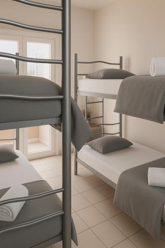 Ένα ή περισσότερα κρεβάτια σε δωμάτιο στο The Tree House Coliving