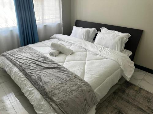 Postel nebo postele na pokoji v ubytování Urban Escape Standalone Stay