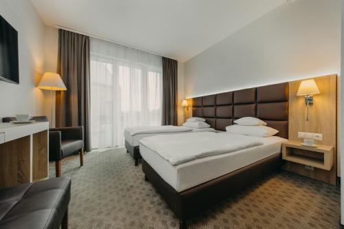 Una cama o camas en una habitación de Osada Śnieżka koło Karpacza