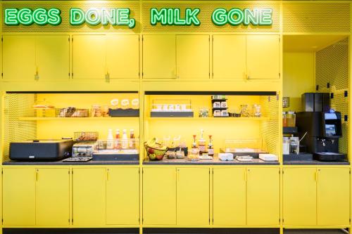 a yellow counter in a store with food on it at CX Modena Crocetta in Modena