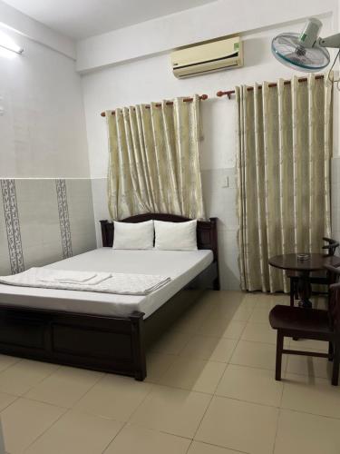 Katil atau katil-katil dalam bilik di Nhà Nghỉ An Hoà