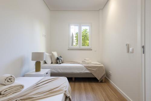 En eller flere senge i et værelse på Mira Mar 1 - Near the beach by HD